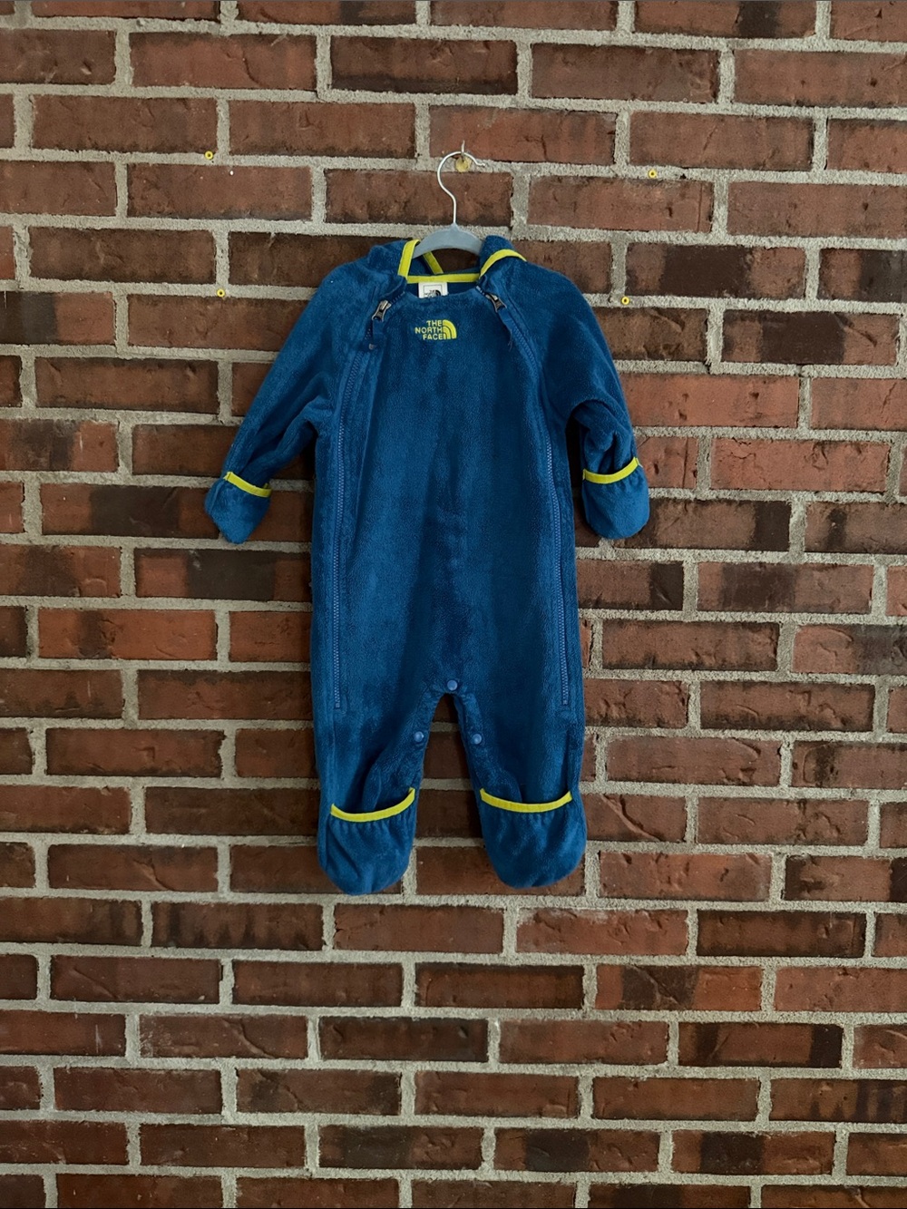 The North Face Navy Blue Fleece Baby Footie with Yellow Trim